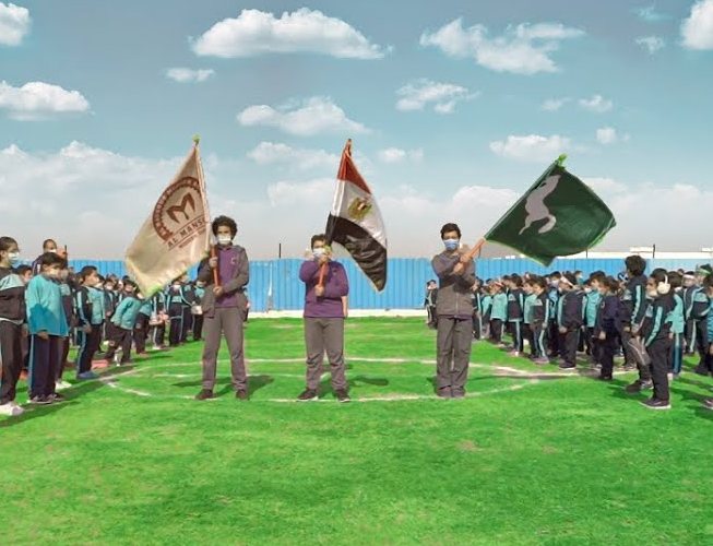 Al Mansour students on sports day with school and national flags